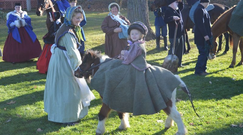 Sidesaddle story: ASA member Nikki Tyler holds the halter as young rider Raelynn and her horse "Gussy" put on a quick demonstration of sidesaddle riding. (credit Anthony C. Hayes)